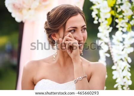 stock-photo-beautiful-sexy-bride-in-white-dress-weeps-tears-of-happiness-on-the-wedding-day-465660293.jpg