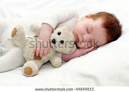 portrait of a close-up, infant lying on the bed