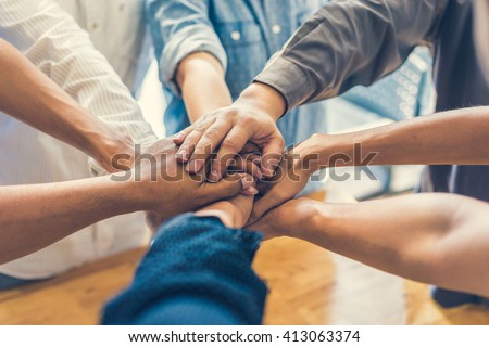 business people making pile of hands , soft focus, vintage tone 