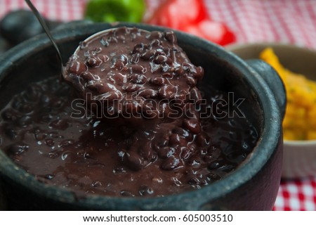 A pan filled with hot brazilians beans