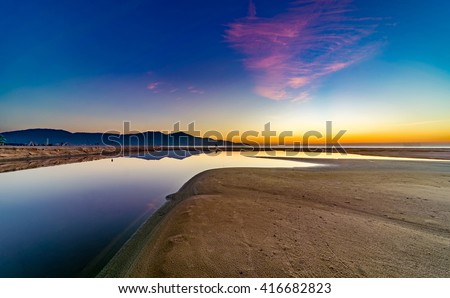 My Khe beach is a beautiful beach in Danang city , Vietnam. The sunrise was reflected in the pond bond before the beach. My Khe Beach is in Top 6 beautiful beach in the World By Forbes Magazine.