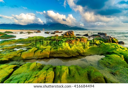 Nam O Beach is a beautiful beach in Danang city , Vietnam. Beautiful moss rocks at the beach is interesting for travel and take a photo.