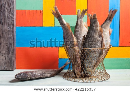 Dried fish hanging on a thread