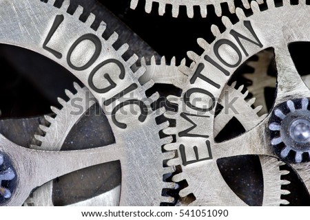 Macro photo of tooth wheel mechanism with imprinted LOGIC, EMOTION concept words