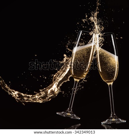 Glasses of champagne with splash