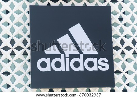 KUALA LUMPUR, MALAYSIA - JULY 2, 2017: Adidas logo. Adidas is a German multinational corporation, headquartered in Herzogenaurach, Germany, designs and manufactures shoes, clothing and accessories.