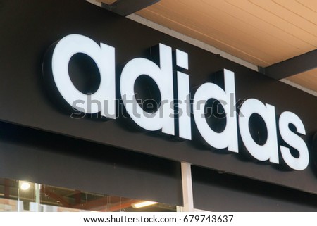 MELAKA, MALAYSIA - JULY 8, 2017: Adidas logo. Adidas is a German multinational corporation, headquartered in Herzogenaurach, Germany, designs and manufactures shoes, clothing and accessories.