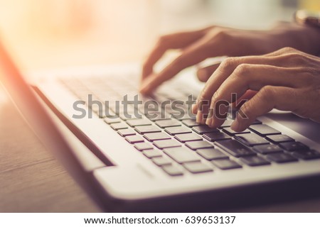 woman using laptop, searching web, browsing information, having workplace at home / soft focus picture / Vintage concept