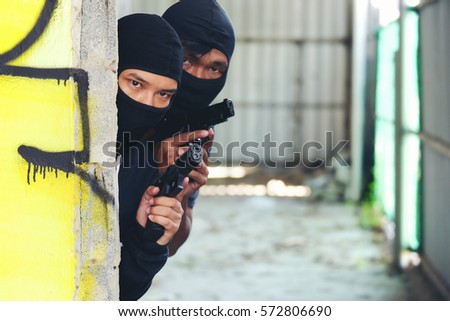 stock-photo-robber-thief-criminal-waiting-for-witness-outlaw-concept-572806690.jpg