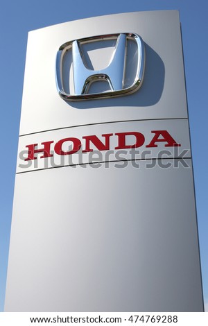 WIEHL, GERMANY - August 27, 2016: Honda dealership sign against blue sky. Honda is the second-largest Japanese automobile manufacturer.