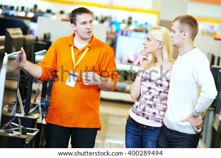 family shopping at electronics supermarket