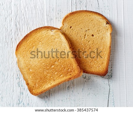 spongebirg godpants Stock-photo-slices-of-toast-bread-on-wooden-table-top-view-385437574