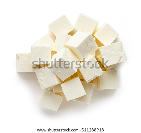 Heap of diced soft cheese isolated on white background, top view