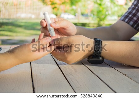 https://thumb1.shutterstock.com/display_pic_with_logo/3947189/528840640/stock-photo-close-up-of-man-hands-help-woman-to-checking-blood-sugar-level-by-glucose-meter-in-the-garden-528840640.jpg