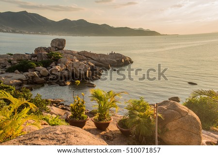 Sea landscape. Evening on the stone beach.Vietnam, Nha Trang. Sunrise on the beach. Sunset.