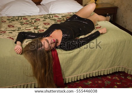 https://thumb1.shutterstock.com/display_pic_with_logo/398806/555446038/stock-photo-strangled-beautiful-woman-in-a-short-black-dress-lies-on-the-bed-simulation-of-the-crime-scene-555446038.jpg