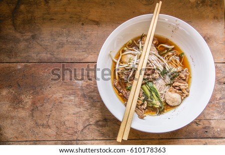 beef noodle soup,beef noodle Traditional on a wooden background