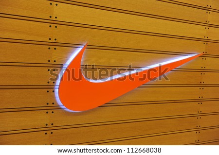 BANGKOK - DEC 27: Exterior of a sporting goods store displaying the Nike Swoosh logo on Dec 27, 2011 in Bangkok, Thailand. Forbes values Nike at $10.7B, making it the most valuable sports brand.