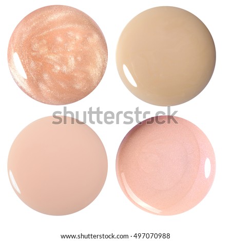 Blots of nail polish and foundation. Isolated on white. Photo