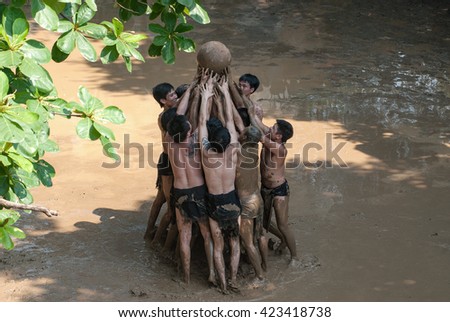BAC GIANG, VIET NAM, May 20, 2016 man team, Van village, Bac Giang, Vietnam. participate in the festival competition ball, traditional materials, on the mud, very unique, the legacy of Vietnam