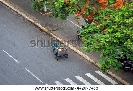HAI PHONG, VIETNAM, June 19, 2016 the woman, silent, working as street sweeping Hai Phong, Vietnam, in the summer
