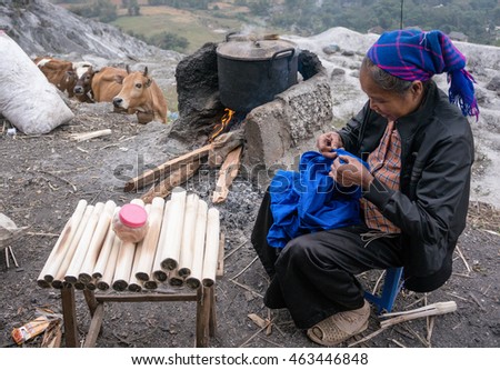 HOA BINH, Vietnam, March 12, 2016 Ethnic Thai woman, highland Hoa Binh, Vietnam, sitting embroidered brocade