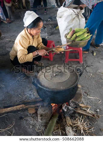 HOA BINH, Vietnam, March 12, 2016 Ethnic Thai woman, highland Hoa Binh, Vietnam. cook corn products