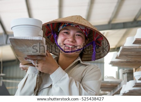 HAI DUONG, Vietnam, July 25, 2016 portrait, woman (name unknown), a worker, Chu Dau pottery, Hai Duong Province, Vietnam