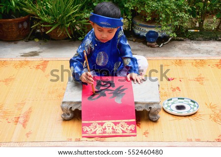 HAI DUONG, Vietnam, September 2, 2016 children, dressed in traditional costumes. Favorite write out, word drought