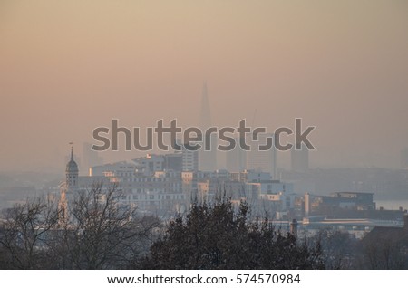 London's polluted skyline at sunset on a winter evening. London had a pollution warning between 21-24th Jan 2017.