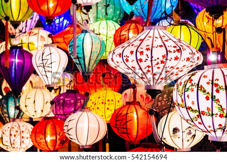 Colorful lanterns spread light on the old street of Hoi An Ancient Town - UNESCO World Heritage Site. Vietnam.