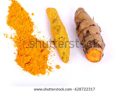 turmeric powder with fresh turmeric root in white