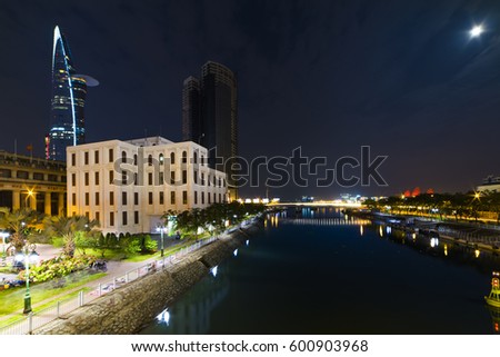 HO CHI MINH CITY, VIET NAM - MARCH 15, 2017: Ho Chi Minh city at night, view from Cau Mong Bridge to Sai Gon river.