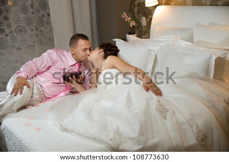 https://thumb1.shutterstock.com/display_pic_with_logo/419500/108773630/stock-photo-newly-married-couple-in-hotel-room-romance-wedding-night-108773630.jpg