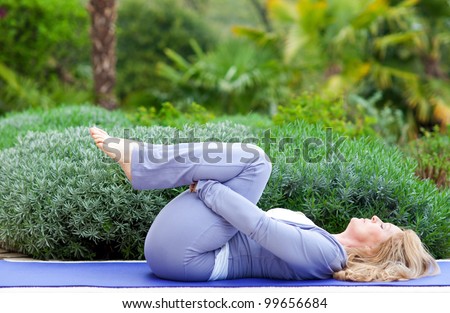 https://thumb1.shutterstock.com/display_pic_with_logo/420274/99656684/stock-photo-mature-woman-doing-yoga-position-outside-in-the-garden-99656684.jpg