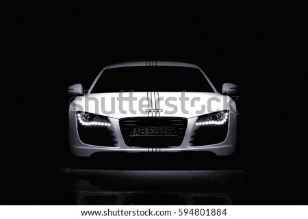 Vinnitsa, Ukraine - November 11, 2012. Audi R8 concept car. showroom.Presentation. Presentation of the new model Audi car - R8.Front of the car,front-side, logo .Black and white autophoto