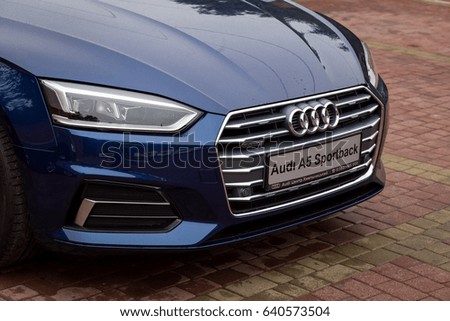 Vinnitsa, Ukraine - May 14, 2017. Audi A5 Sportback car.Front of the car, logo Audi,TFSI engine, quattro system, sportcar, luxury car,sport sedan. Presentation of the new model car- Audi A5 Sportback