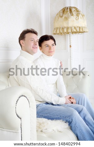 https://thumb1.shutterstock.com/display_pic_with_logo/4225/148402994/stock-photo-smiling-husband-and-wife-look-away-and-dream-on-white-leather-sofa-at-home-148402994.jpg