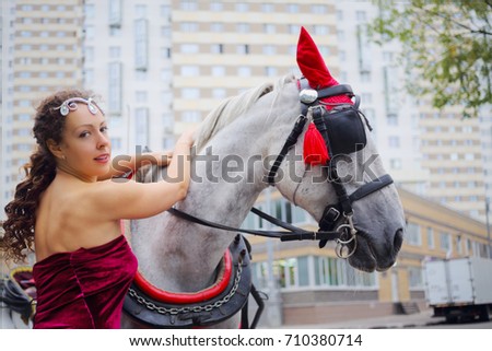 Women dressed up in horse harness gear Women dressed up in horse harness gear