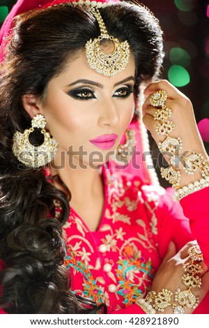 https://thumb1.shutterstock.com/display_pic_with_logo/423265/428921890/stock-photo-portrait-of-a-beautiful-female-model-in-traditional-ethnic-indian-asian-bridal-outfit-with-heavy-428921890.jpg