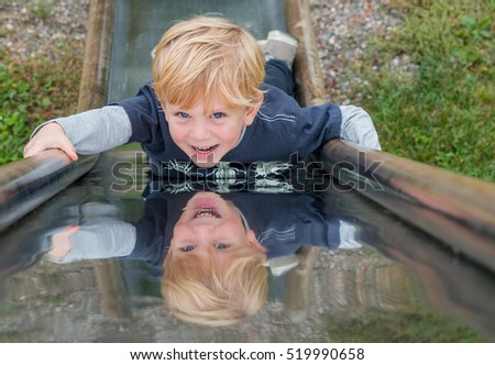 Child on a Metal Slide