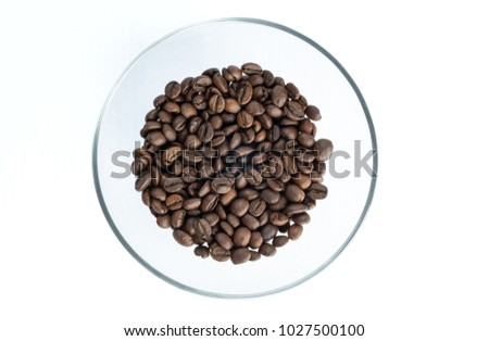 Roasted Coffee Beans On A Glass Transparent Plate Isolated White Background Roasted Coffee Beans On A Glass Transparent Plate Isolated White Background