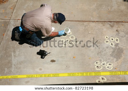 a crime scene detective investigates and gathers evidence at a drive by shooting crime scene - Description Of A Crime Scene Investigator a crime scene detective investigates and gathers evidence at a drive by shooting crime scene - Description Of A Crime Scene Investigator