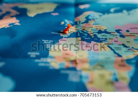 red pin on the map and travel destination europe