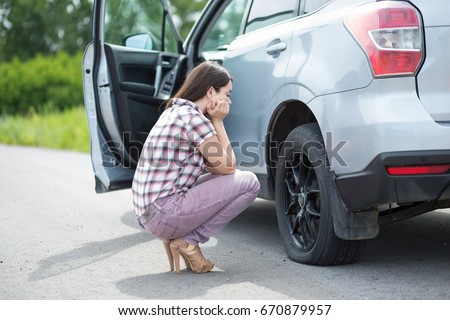 Image result for woman flat tire