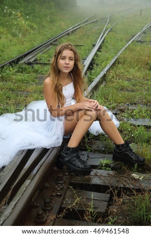 https://thumb1.shutterstock.com/display_pic_with_logo/4317751/469461548/stock-photo-very-beautiful-blonde-teen-girl-with-beautiful-long-legs-in-short-shorts-black-boots-and-a-white-t-469461548.jpg