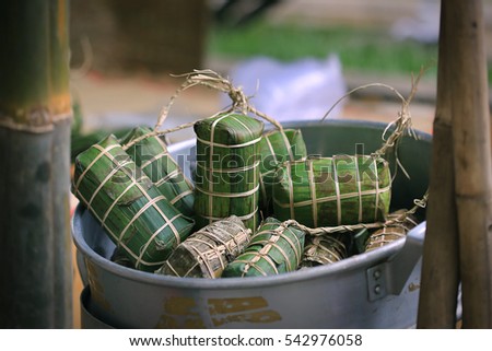 Tet cake (Banh Tet) is a cake made primarily from glutinous rice, which is rolled in a banana leaf into a thick, log-like cylindrical shape, with a mung bean and pork filling, then boiled.