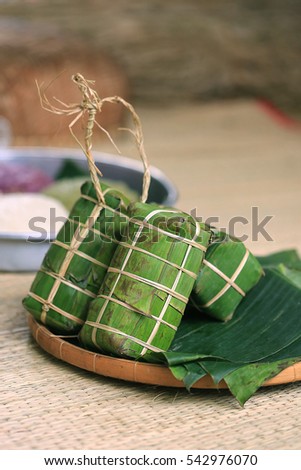 Tet cake (Banh Tet) is a cake made primarily from glutinous rice, which is rolled in a banana leaf into a thick, log-like cylindrical shape, with a mung bean and pork filling, then boiled.