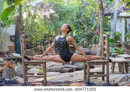 https://thumb1.shutterstock.com/display_pic_with_logo/4374616/604771103/stock-photo-woman-meditates-while-practicing-yoga-in-the-wood-garden-she-freedom-concept-calmness-and-relax-604771103.jpg