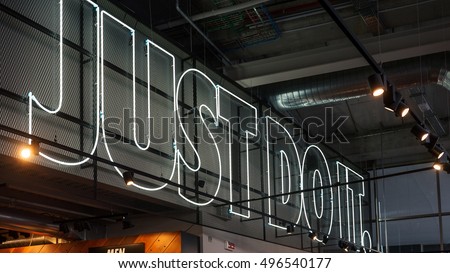 MILAN, ITALY - SEPTEMBER 27, 2016: JUST DO IT inside Nike store. Nike is one of the world's largest suppliers of athletic shoes and apparel. The company was founded on January 25, 1964.